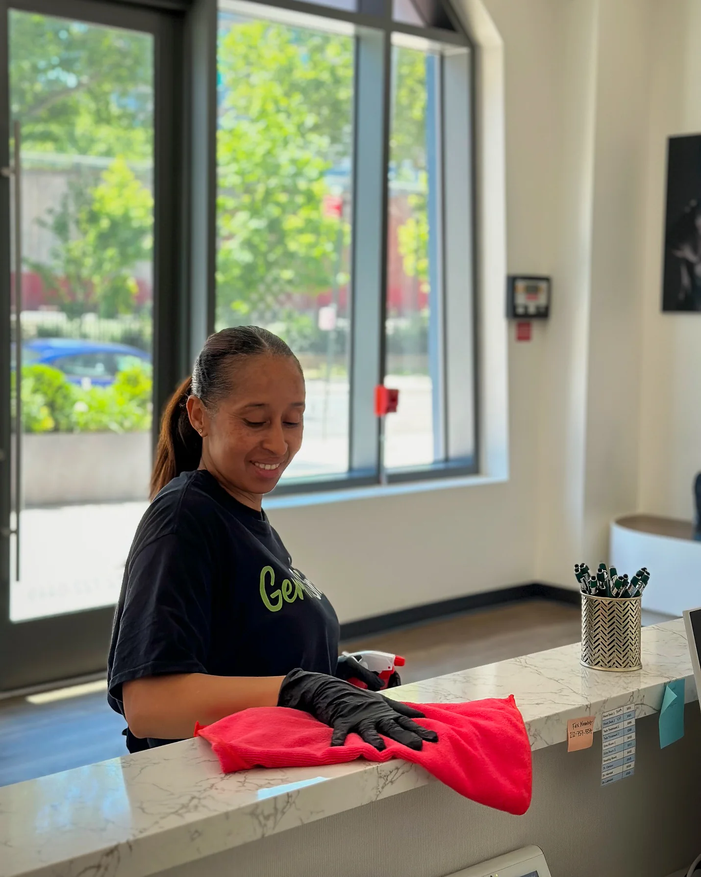 GermSmart team member cleaning a customer-facing commercial counter