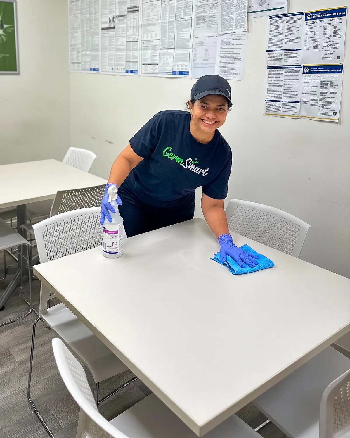 GermSmart cleaner wiping an accessible surface in a shared facility